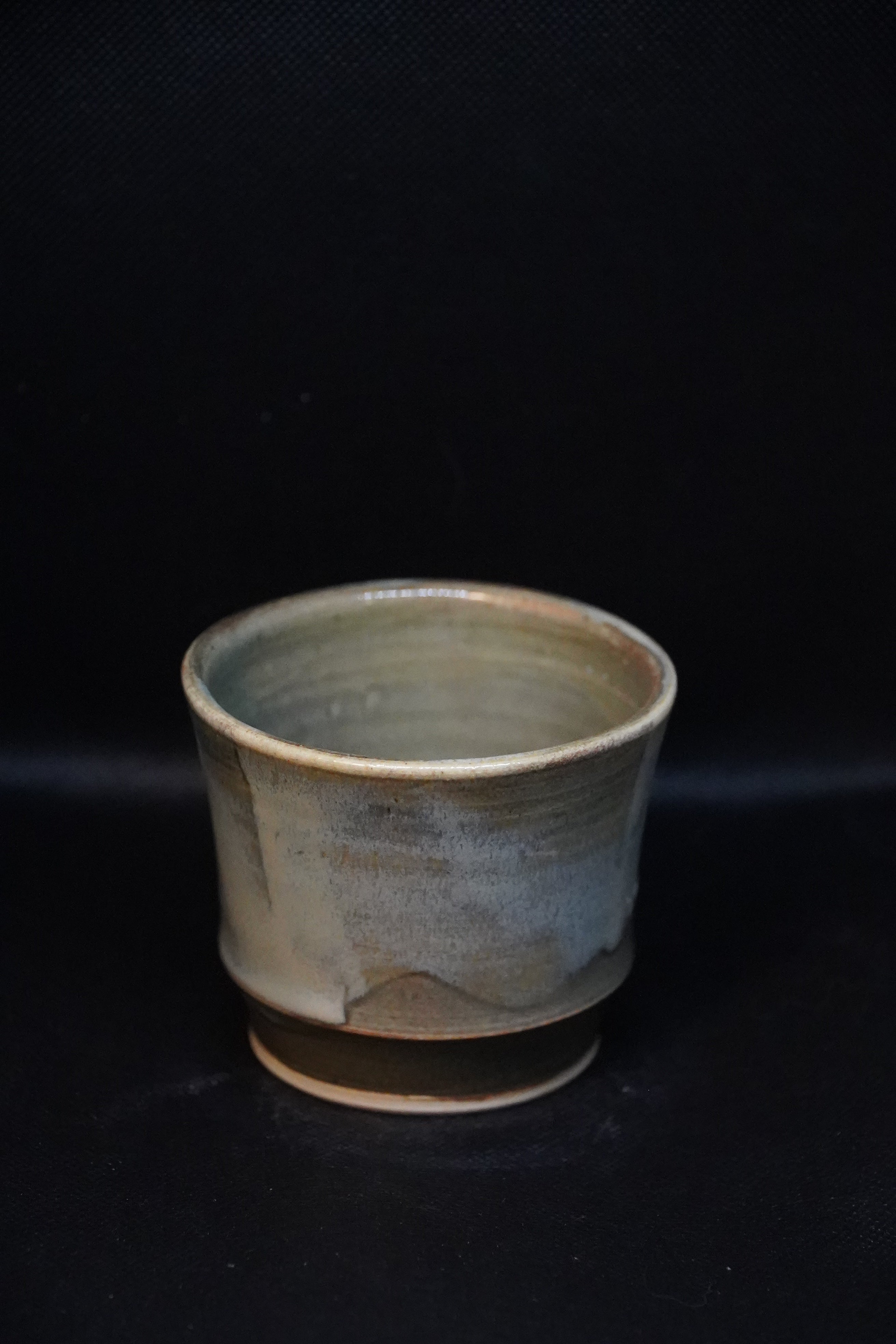 Handmade ceramic tea cup with shadow green and shorebreak glazing 250ml